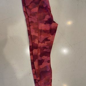 Athleta ultimate stash pocket printed 7/8 tight. Red tone.